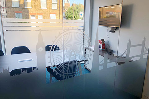 A photo of a meeting room with glass partition graphics as a finishing touch for the office fit out